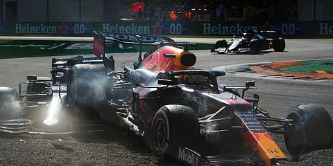 Red Bull driver Max Verstappen of the Netherlands (R) and Mercedes driver Lewis Hamilton of Britain crash during the Italian Formula One Grand Prix, at Monza racetrack, in Monza, Italy. (Photo | AP)