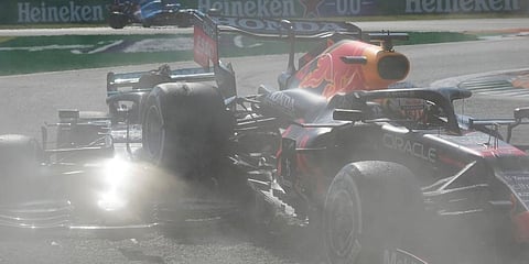 Red Bull driver Max Verstappen of the Netherlands, right and Mercedes driver Lewis Hamilton of Britain crash during the Italian Formula One Grand Prix. (Photo | AP)