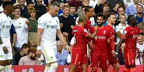 Liverpool's Mohamed Salah celebrates with teammates after scoring against Leeds. (Photo | AP)