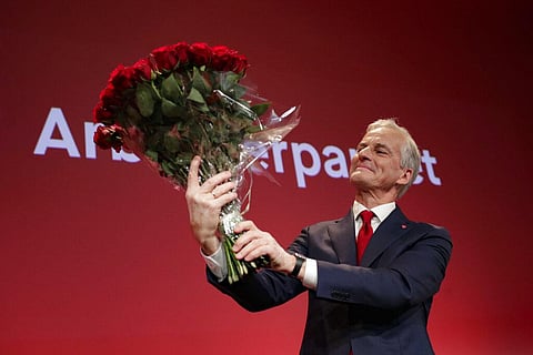 Labor leader Jonas Gahr Stoere holds a bouquet of red roses at the Labor Party's election vigil for the 2021 parliamentary elections. (Photo | AP)