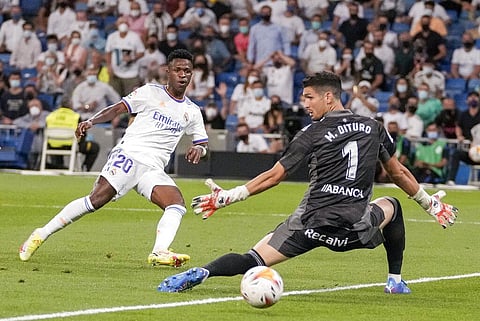 Real Madrid's Vinicius Junior, left, kicks the ball to score during La Liga match against Celta de Vigo at Bernabeu stadium in Madrid, on Sunday. (Photo | AP)