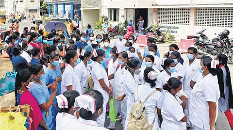 Nurses recruited for Covid-19 duty at the Government Kilpauk Medical College Hospital protest on the Directorate of Medical Education campus on Monday | R Satish Babu