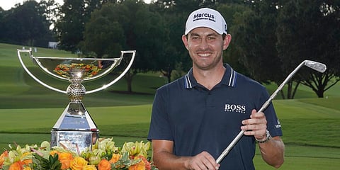 Patrick Cantlay poses with the trophies after winning the Tour Championship golf tournament and the FedEx Cup at East Lake Golf Club in Atlanta. (Photo| AP)