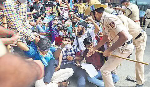 Around 300 students, who were protesting against the implementation of the NEP in Karnataka, were thrashed by the police near KR Circle in Bengaluru on Tuesday morning as they tried to march towards V