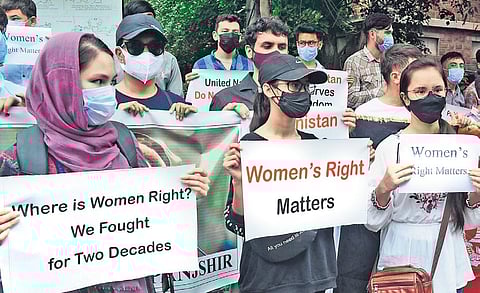 Andhra University students from Afghanistan stage a demonstration demanding freedom for their country from the Taliban, in Vizag on Thursday. (Photo| EPS/G Satyanarayana)