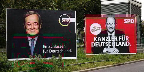 Campaign posters of Armin Laschet (L) and Olaf Scholz (Photo | AP)