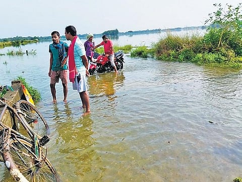 A flooded road in Baga village under Nachinda panchayat of Bhograi block.