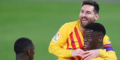 Former Barcelona stars Ilaix Moriba and Lionel Messi (Photo | AFP)