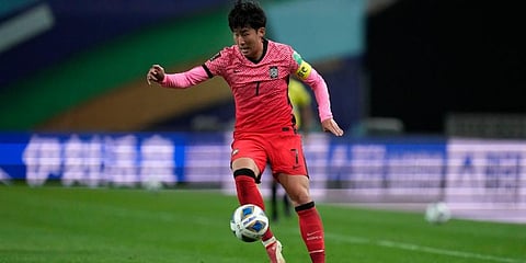South Korea's Son Heung-min dribbles during an international game against Iraq. (Photo | AP)