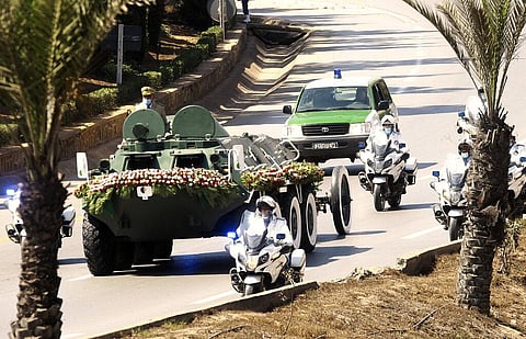 The convoy carrying the coffin of former Algerian President Abdelaziz Bouteflika drives on its way to the El Alia cemetery in Algiers (Photo | AP)