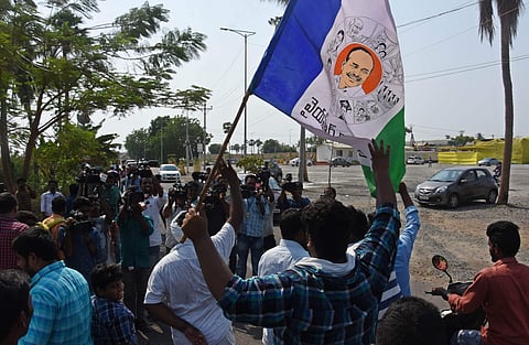 YSRCP workers wave the party flag. (File Photo | EPS)