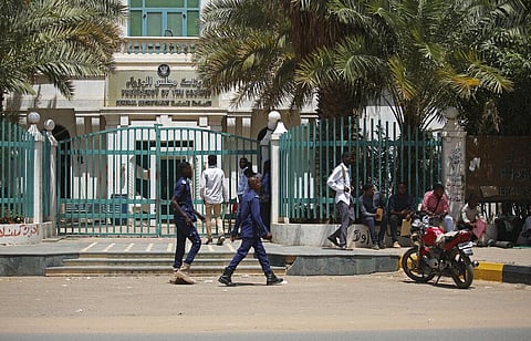 Sudanese soldiers walk in front of the office of the Sudanese Council of Ministers, in Khartoum, Sudan. (Photo | AP)