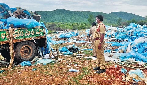 Police get plastic waste removed dumped at PVG village in Kadapa| EXPRESS