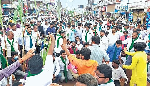 Sugarcane farmers stage a protest in Zaheerabad on Wednesday demanding opening of a local sugar mill in the town