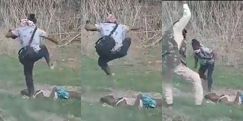 The photographer was seen being led out by a policeman, but soon returned, jumped over a man's body, and hit him with something he had picked up lying close by. (Photo | Twitter)