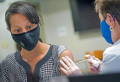 Tuesday Ward of West View in Pittsburgh receives a COVID-19 booster shot at Allegheny General Hospital on Pittsburgh's North Side. (Photo | AP)