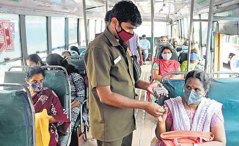 File picture of a conductor issuing a ticket to a woman passenger before the free ride scheme was introduced | Express
