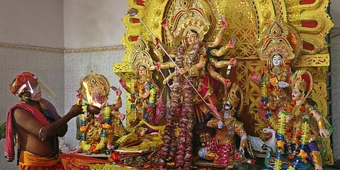 A priest with face guard performing Mahaashtami Durga puja. (File Photo | EPS)
