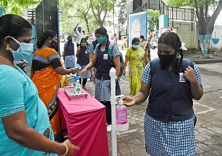 Students of Govt Girls Higher Sec. school at Ashok Nagar step into their campuses for the first time on Wednesday after a long gap due to Pandemic. (Photo | EPS/Ashwin Prasath)