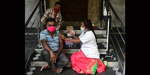 A health worker vaccinates a beneficiary in Bengaluru. (Photo | Express)