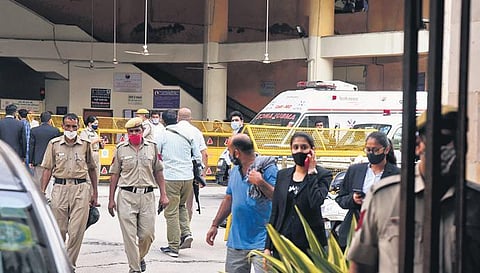 Police personnel and others at the Rohini court after the shootout. (Photo | Parveen Negi, EPS)