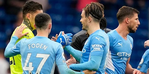 Manchester City players celebrate at the end of the EPL match against Chelsea at Stamford Bridge Stadium in London. (Photo | AP)