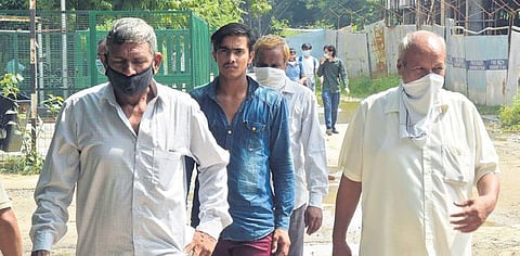 Relatives of Jitender Gogi arrive to receive his body at a hospital. (Photo | Parveen Negi)