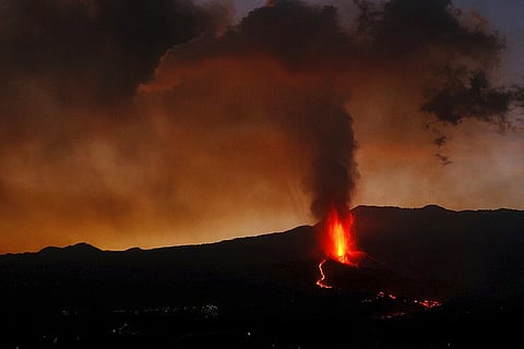 Lava flows from a volcano on the Canary island of La Palma, Spain in the early hours of Sunday. (Photo | AP)