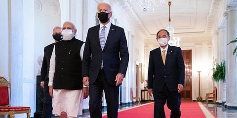 President Joe Biden walks to the Quad summit with, from left, Australian PM Scott Morrison, Indian PM Narendra Modi, and Japanese PM Yoshihide Suga, in the East Room of the White House. (Photo | AP)