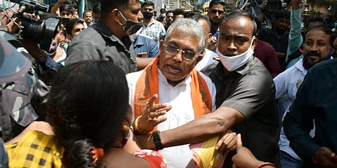 BJP national vice-president Dilip Ghosh clashes with TMC supporters during an election campaign in Kolkata. (Photo| ANI)