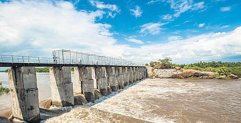 Amaravathi river flowing through the Chettipalayam check dam in Karur | express