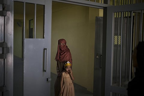 Razia and her 6-year-old daughter Alia, stand inside the women's section of the Pul-e-Charkhi prison in Kabul, Afghanistan. (Photo | AP)