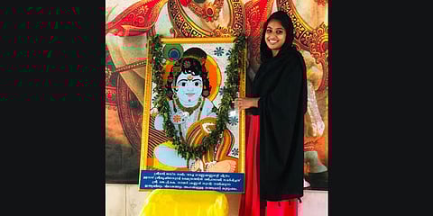 Jasna Salim with her painting of .Little Krishna at Ulanadu Sree Krishna Swamy temple in Pandalam.