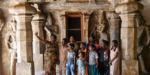 Children having fun at the Pallava Caves, a prominent tourist destination in Tiruchy, on Monday (Photo |M K Ashok Kumar/Express)