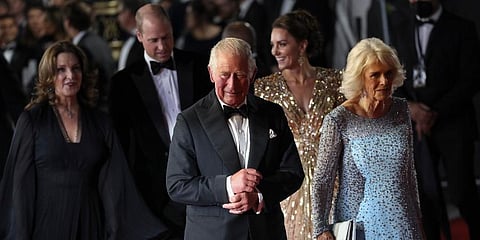 Prince Charles, front centre and his wife Camilla the Duchess of Cornwall, front right, Barbara Broccoli, from back left, Britain's Prince William and his wife Kate the Duchess of Cambridge. (AP)