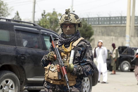 Taliban special forces fighters stand guard outside the Hamid Karzai International Airport after the U.S. military's withdrawal. (Photo | AP)