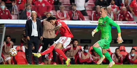 Benfica's Darwin Nunez tries a shot as Barcelona's goalkeeper Marc-Andre ter Stegen chases after him. (Photo | AP)