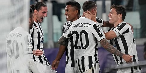Juventus' Federico Chiesa (R) celebrates with teammates after scoring against Chelsea. (Photo | AP)