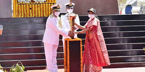 Home Minister Mekathoti Sucharita and Vice-Admiral Ajendra Bahadur Singh inducting the ‘Victory Flame’ on RK Beach in Visakhapatnam on Friday | Express