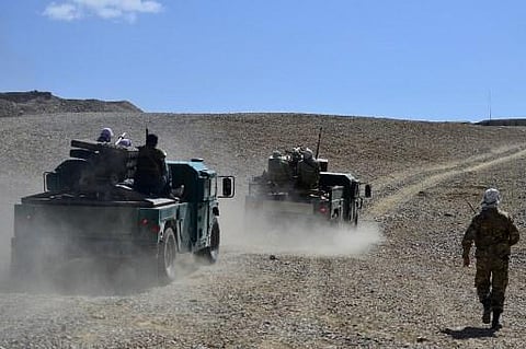 Afghan resistance movement and anti-Taliban uprising forces personnel patrol in armoured humvees at an outpost in Kotal-e Anjuman of Paryan district in Panjshir province (Photo | AFP)