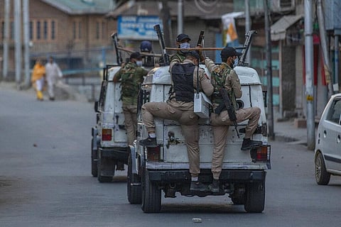 Indian policemen ride armoured vehicles after dispersing Kashmiri protesters during day-long security restrictions in Srinagar. (Photo | AP)