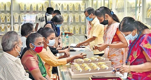 A representational picture of employees standing during their work at a jewellery showroom in Chennai | P Jawahar