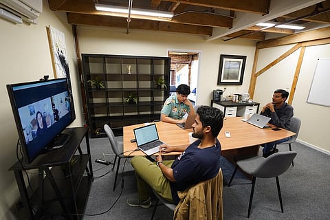 RunX CEO Ankur Dahiya, center, takes part in a video meeting with employees JD Palomino, top left, and Nitin Aggarwal, right, at a rented office in San Francisco, Friday, Aug. 27, 2021. (Photo | AP)