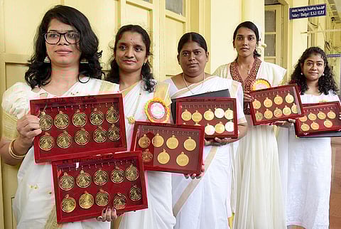 Chaitra Narayan Hegde, Vidyashree LR, Madalambike TS, Harshitha N and Sindhu Nagaraj with their medals in Mysuru on Tuesday | Udayshankar S