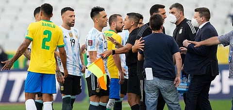 Brazil and Argentina's player talk as the soccer game is interrupted by health authorities during a qualifying match for the FIFA World Cup Qatar 2022 in Sao Paulo, Brazil, Sept 5, 2021. (Photo | AP)