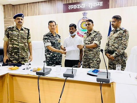 Surrendered Maoist Sodi Muya with Sukma police and the CRPF DIG in south Chhattisgarh. (Photo | EPS)