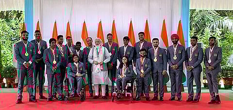 Prime Minister Narendra Modi with the Indian contingent of the 2020 Summer Paralympics, in New Delhi. (Photo | PTI)