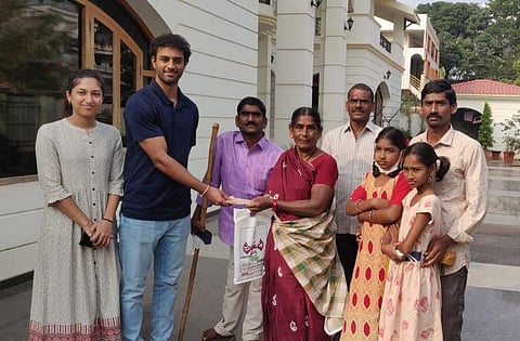 Nemani Pranav with Sattaiah in 2010. A sum of Rs 25,000 being paid to the peanut vendor’s family (Photo | Express)