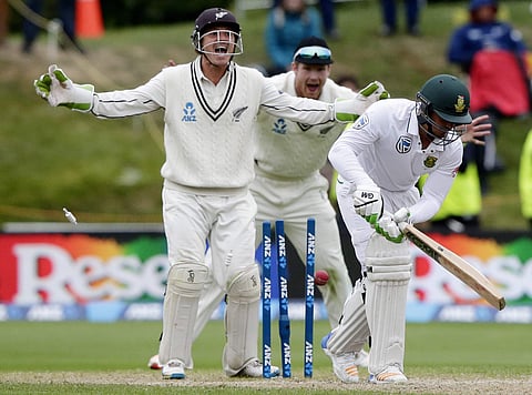 Quinton de Kock, right, is out bowled against New Zealand in this 2017 file photo. (AP Images)
