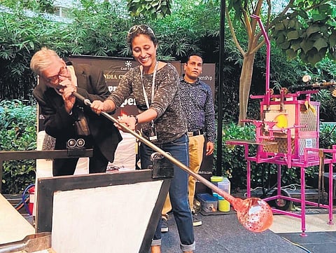 One of Glass Sutra’s patrons glassblowing.